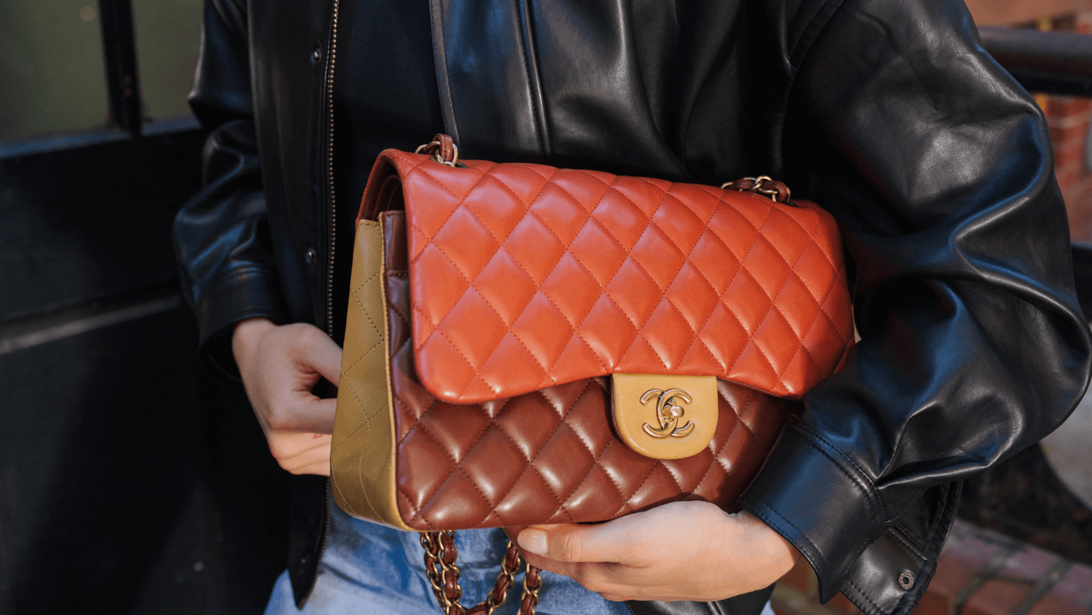 Quilted Chanel bag red held by model