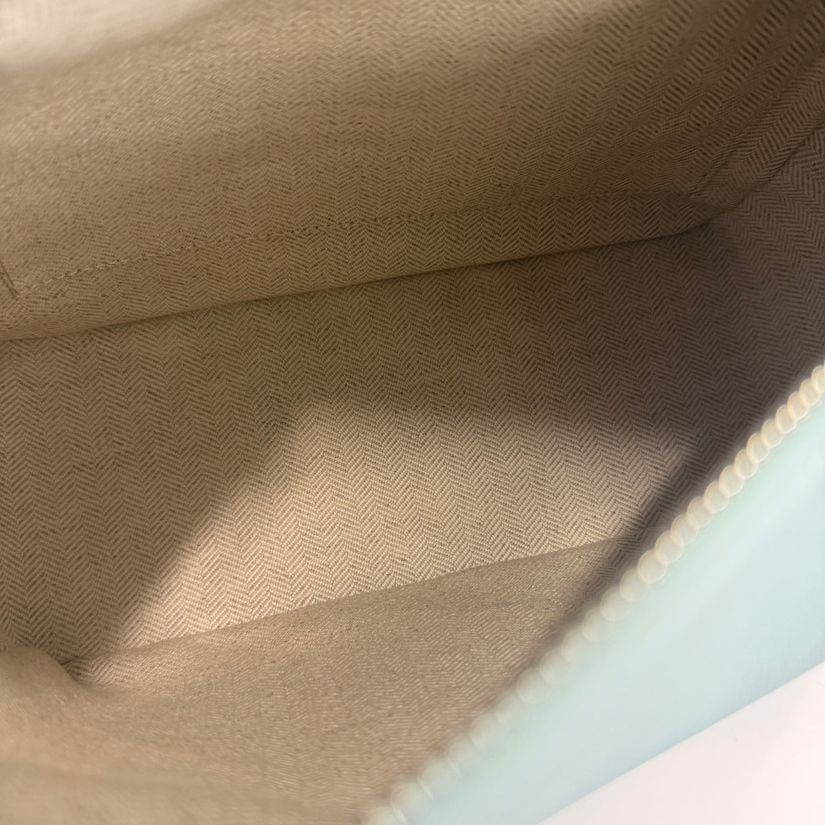 Light Blue Grained Calfskin Small Puzzle Edge Bag